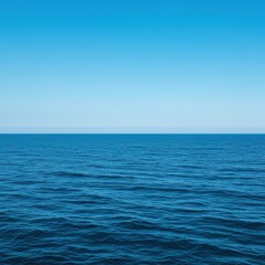 Vast expanse of deep blue ocean water under a clear sky, showing gentle waves and a distant, peaceful horizon ,beautiful ,vast ,expansive