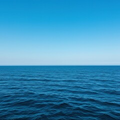 Vast expanse of deep blue ocean water under a clear sky, showing gentle waves and a distant, peaceful horizon ,sky ,vastness ,pure