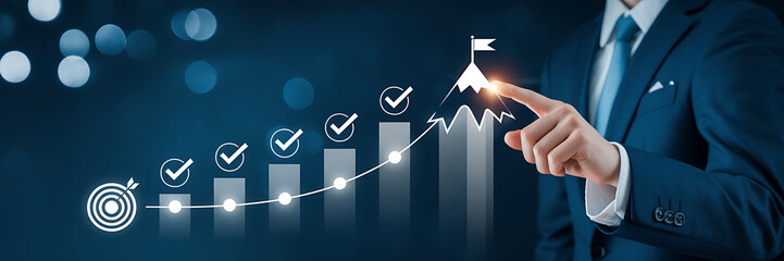 Businessman pointing at digital graph showing progress towards a mountain peak goal with checkmarks indicating achievement milestones