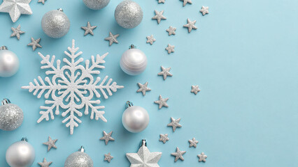 Silver decorations and snowflakes on a blue background for winter and holiday festivities