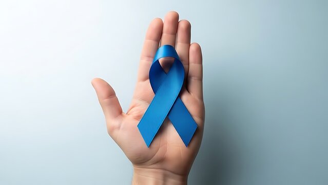 Show your support holding a blue ribbon for prostate cancer awareness