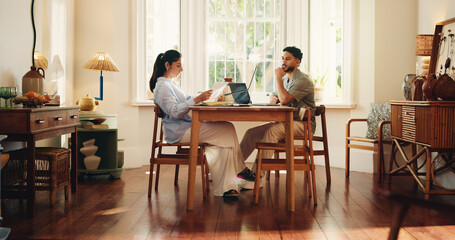Couple, reading and document with laptop at house for accounting, finance report and loan application. People, pc and review paperwork for budget, expenses information and mortgage insurance in home