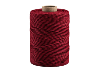 Spool of dark red thread, tightly wound on a brown cardboard core, against black