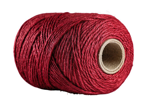 Close-up shot of a spool of tightly wound, deep red twine on a brown cardboard core