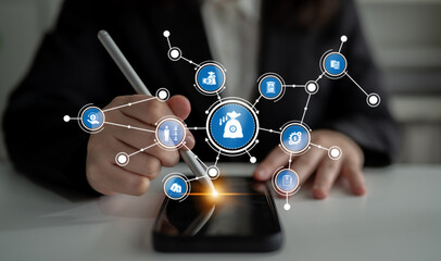 A business professional engages with a smartphone to manage finances and analyze data, surrounded by digital icons representing money and analytical tools in a modern workspace. Tessel