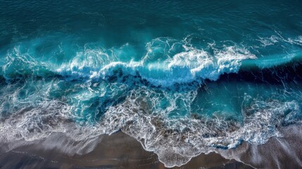 Fototapeta premium The ocean is calm and peaceful, with a gentle wave rolling in. The water is a deep blue color, and the sky is clear and bright. The scene is serene and relaxing, and it evokes a sense of calm
