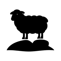 Black silhouette of a sheep standing on a hill