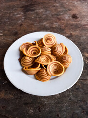 kue Kuping Gajah is a traditional Indonesian snack or cookies. That has a sweet and crunchy taste, and has a spiral pattern and is shaped like an elephant's ear