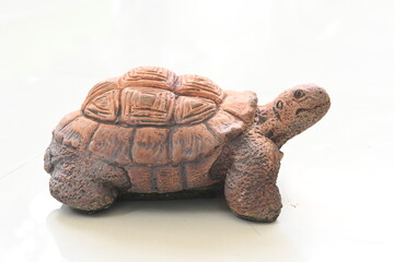 A turtle sculpture made from plaster
