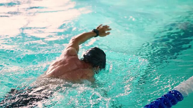 Dynamic and Engaging Swimming Technique Showcased in Two Stunning Frames Illustrating the Grace and Efficiency of a Swimmer in Action in a Pool Environment