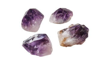 Fototapeta premium Four amethyst crystals, each with a mix of purple and white hues, are isolated on black