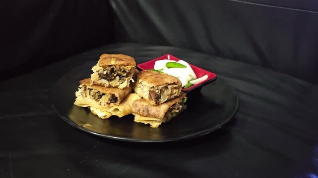cake with chocolate Martabak telur,Egg martabak,Murtabak,Mutabbaq,suffed pancake,Pan fried bread with egg,meat,spring onion and vegetables filling,served with sambal or cayenne pepper,achar or pickle 