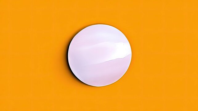 A white circle is centered on a vibrant orange background, creating a minimalist and abstract composition.
