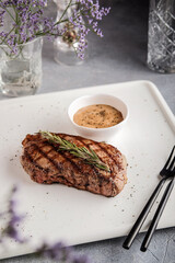 Exquisite culinary display featuring seasoned meat and aromatic herbs