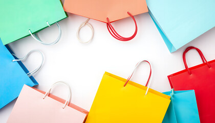 Colorful shopping bags arranged in a circle on a white background