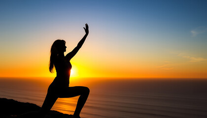Silhouette of a woman in a yoga pose against a vibrant sunset over the ocean