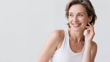 Fototapeta premium Beautiful senior caucasian woman smiling looking back