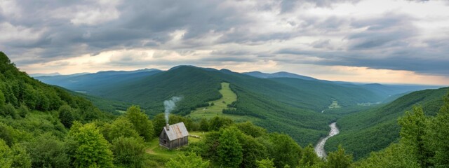 Remote mountain cabin nestled amidst lush green valleys and dramatic clouds