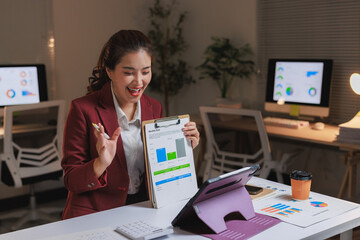 Young businesswoman presenting financial data during video conference