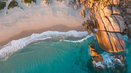 Aerial view of tropical beach with turquoise water and rocks for travel and vacation planning