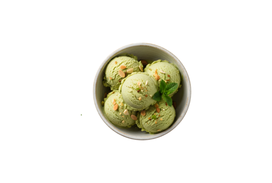 Green ice cream set against a white stone backdrop, seen from above, with space for text. This green treat could be pistachio, avocado, or green tea gelato, garnished with almonds and mint leaves.
