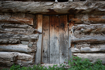 Wooden walls and doors in Olgunlar Plateau. Wooden doors from historical buildings. Wooden doors from old stone buildings. Wooden textures from the plateau phase. Artvin, Türkiye.
