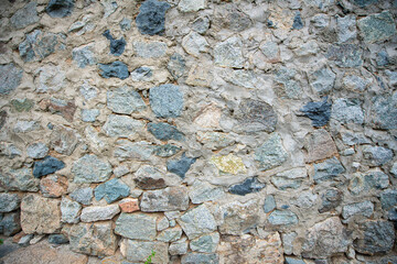 Stone walls of historical buildings. Stone walls of old wooden buildings. Stone-built architecture. Stone walls of historical Birgi houses in the Ödemiş district. Türkiye.