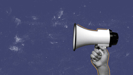 Hand holding a megaphone against a blue backdrop for communication and activism