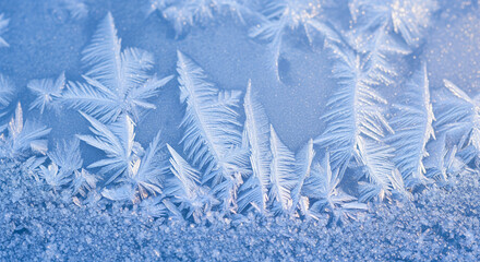 Elegant winter background with sparkling blue snowflake