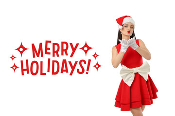 Woman wearing Santa hat and red dress blowing kisses