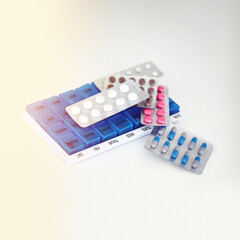 Pills, medicine and daily container for health with medication, prescription and reminder. Drugs, plastic storage and mockup space for pharmaceutical wellness, illness treatment and chronic disease