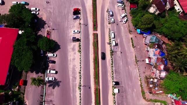 Reveal shot of Colva creek contamination colva beach with parking area and vehicles at goa. day time, push in, tilt up, drone shot, 4k.
