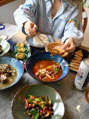 young woman eatting Southern Thai Cuisine in restaurant