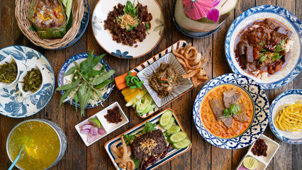 Northern Thai food on wood table in the coffee shop