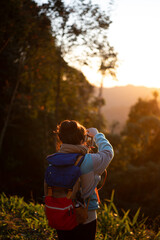 yong woman take a photo of sunrise in the morning