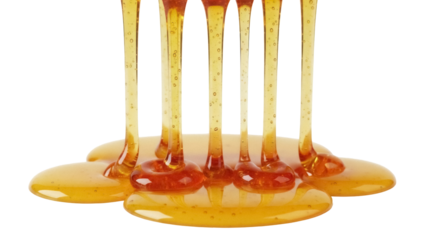 Golden honey pouring isolated PNG on transparent background, sweet liquid dripping for food and dessert design, natural sweetener
