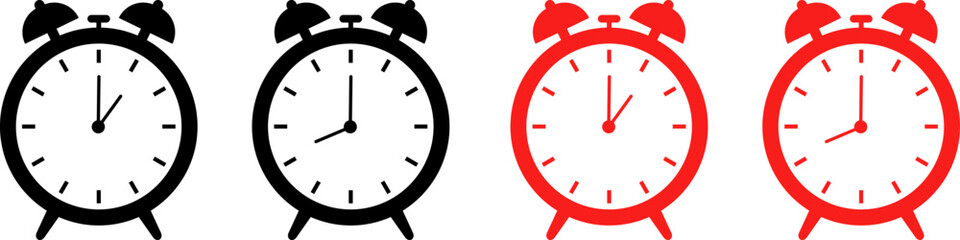 Two pairs of vintage alarm clocks showing different times