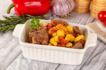 Ragout with meat, potato and tomatoes