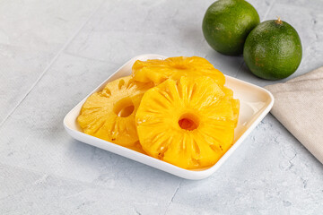 Sweet canned pineapple slices in syrope