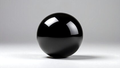 A lustrous, obsidian-like sphere rests upon a subtly lit, neutral-toned surface. Reflections enhance its smooth, polished texture