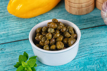 Pickled canned capers in the bowl