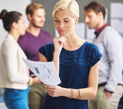 Woman, thinking or reading in office with paperwork for floor plan, interior design or creative idea. Team, person and designer with layout document for renovation blueprint, project info or thought.