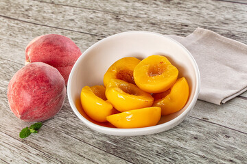 Sweet ripe yellow canned peaches