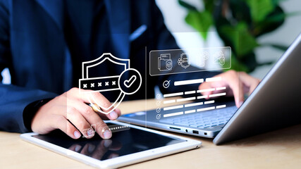 Businessman typing on laptop with virtual login interface overlay showing username, password, and security lock. Concept of data protection, identity verification, and cybersecurity.