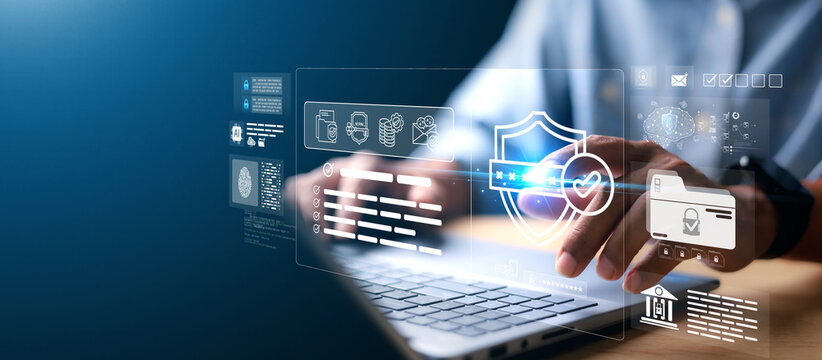 Businessman typing on laptop with virtual login interface overlay showing username, password, and security lock. Concept of data protection, identity verification, and cybersecurity.