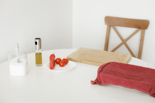 Ingredients for cooking a delicious meal are sitting on a white table
