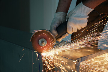 worker cutting metal