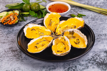 Baked oyster with cheddar cheese