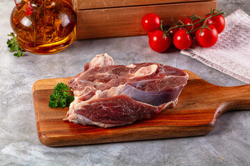 Raw lamb steak with bone