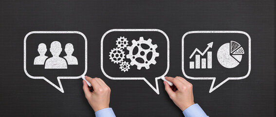 Concept image of business communication at meeting, Businessmen drawing speech balloons on chalkboard